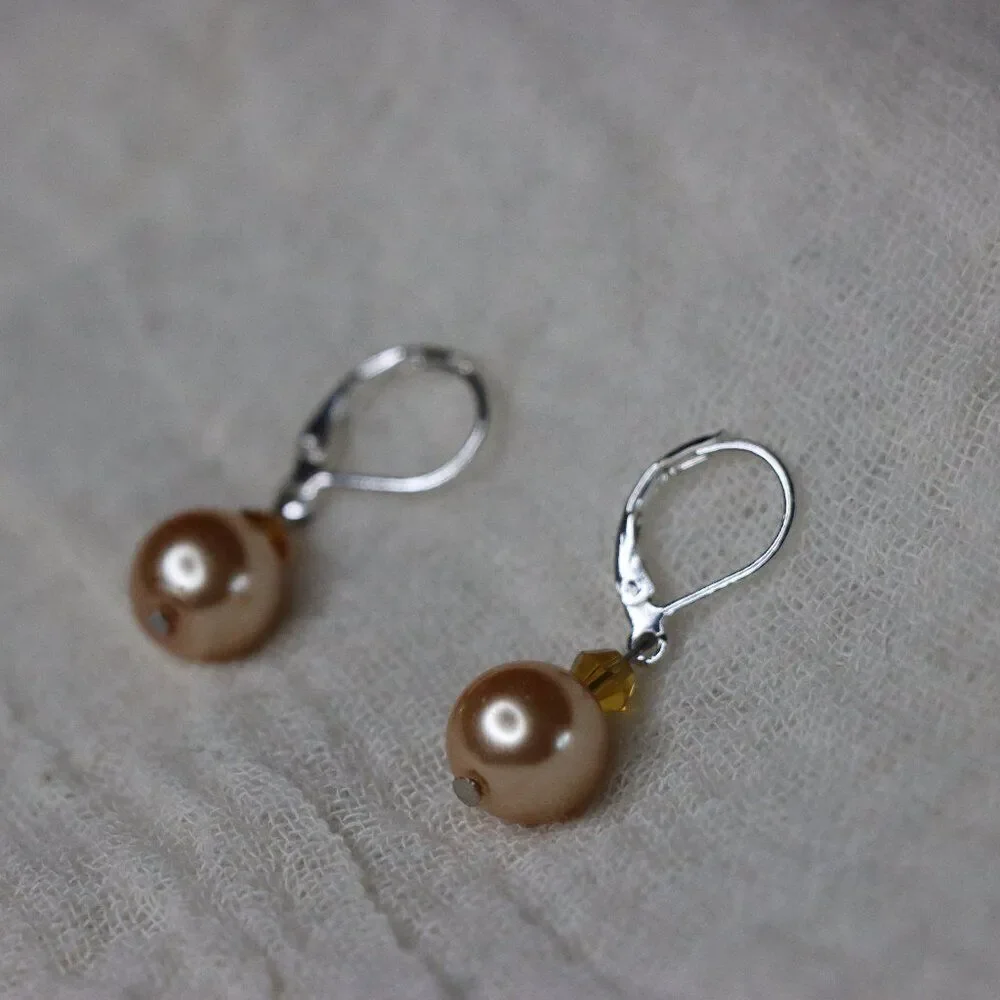 Round Peach Pearl styled drop earrings with silver color loops for pierced ears